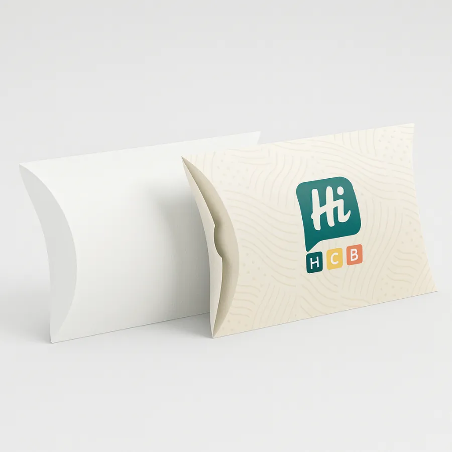 Simple- curved pillow packaging boxes- one is solid white- and the other has a beige brand print- class=